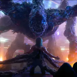 Potężne potwory z Stranger Things otaczają postać.